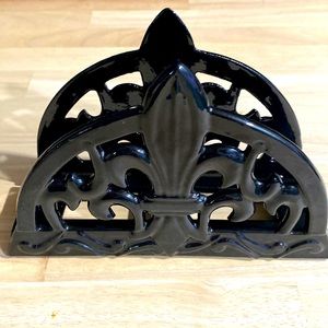 Fleur De Lis metal with a black ceramic coating.